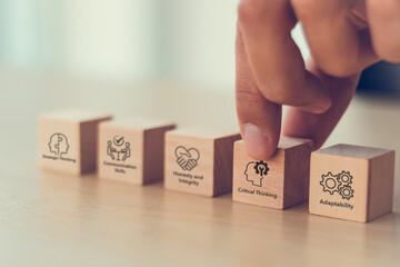 Soft skills (human skills), the value of the human in the age of AI. Wooden blocks with icons...