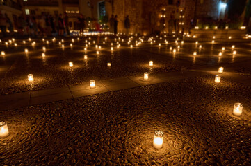 Peaceful Night Scene Illuminated by Candles in an Outdoor Setting