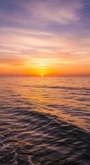 Obraz premium Golden Sunset Over Calm Ocean Waters