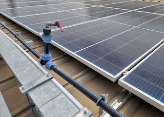 The perspective of HDPE Pipe way and water tap of solar rooftop water pumping system on the factory...