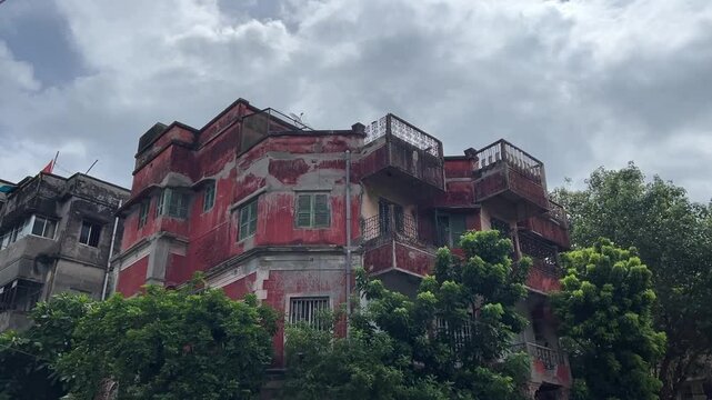 Red colored Zamindar building in Kolkata, India.