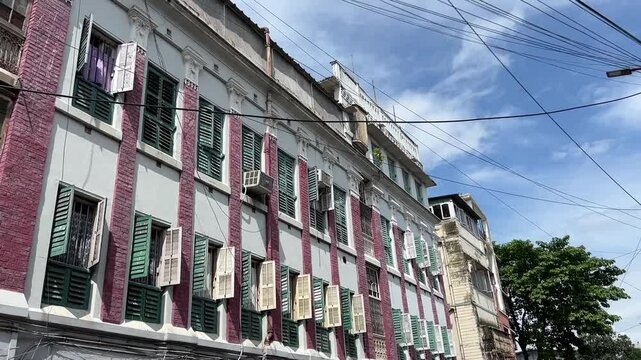 Vintage building with multiple windows in Kolkata, India 