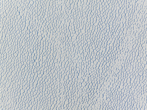 Aerial view of the stark, undulating landscape resembles a cracked, icy expanse, hinting at the raw, untouched beauty of the high-altitude desert, San Pablo de L&Atilde;&shy;pez, Potosi Department, Bolivia.