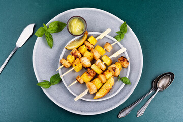 Succulent scallops cooking with pineapple.