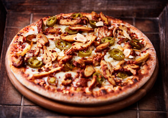 Gyros Pizza with jalapeno pepper and mozzarella cheese. Soft focus. Close up.	