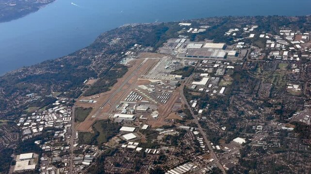 Everett, WA, USA - 4k aerial video footage, overflying the area around Seattle Paine Field International Airport with  "The Boeing Company" Everett Production Facility for airplane production