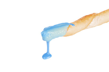 a blue liquid pouring from a baguette