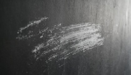 Obraz premium Close-up of textured gray surface with white paint splatter. Brush stroke gives artistic touch. Gray surface adds depth, contrasts with smooth white paint.