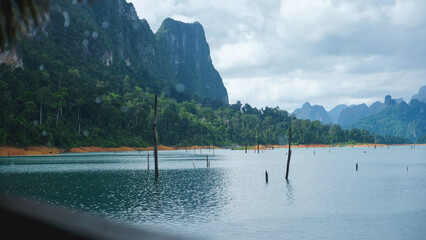 Raining over the reservoir and mountain views of Cheow Lan Lake, Khao Sok, Surat Thani Thailand...
