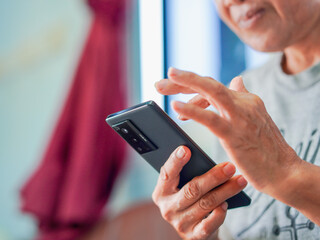 Close up hand people using smartphone browsing internet, business, text or online shopping. Senior...