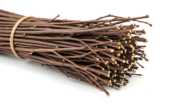 Pile of dry brown cumin seeds on a wooden background with a metal nail