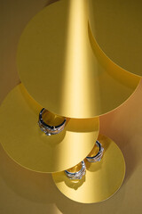 Close-up of jewelry on colored paper