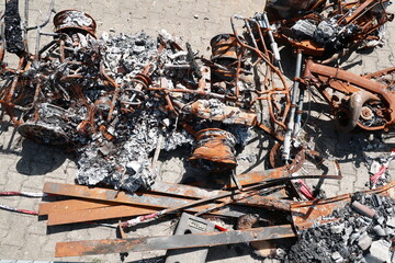 A pile of rusted metal and burnt debris