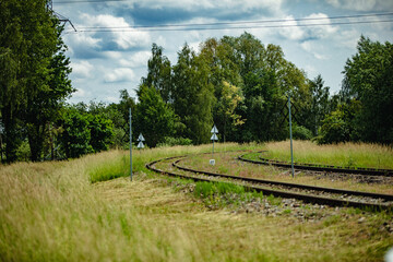 Curving Railway Tracks Beautifully Surrounded by Lush Greenery and Scenic Landscapes