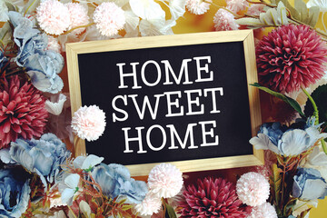 Home Sweet Homey text with flowers decoration on yellow background