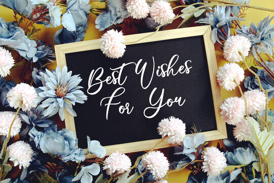 Best Wishes For Youy text with flowers decoration on yellow background
