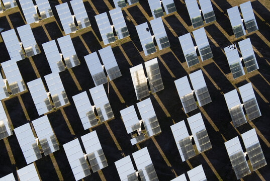 Aerial view of a concentrated solar power plant with mirrors reflecting the sunlight, creating a pattern of light and shadow, Almer&Atilde;&shy;a, Andalusia, Spain.