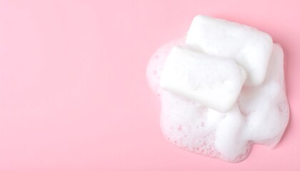 Obraz premium White soap bars in a pink foam