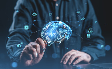 Human hand interacting with glowing digital brain model surrounded by futuristic technology icons...