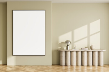 Minimalist interior with blank poster frame on light wall beside modern console table and decor in...