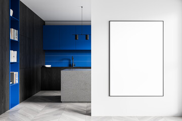Modern kitchen interior with blue cabinets and a blank poster mockup on a white wall, ideal for...