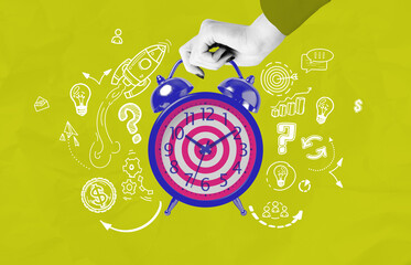 Alarm clock with a target face held by a hand surrounded by startup and productivity concept...