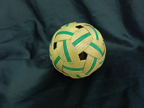 synthetic rattan sepaktakraw or takraw or  buka ball, kick volleyball or foot volleyballball on black background , closeup of photo taken in malaysia.