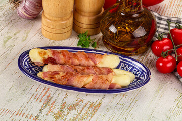 Hot mozzarella sticks with bacon
