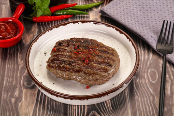 Grilled beef burger cutlet with sauce