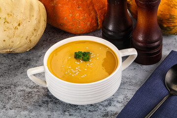 Vegan pumpkin cream soup served sesam