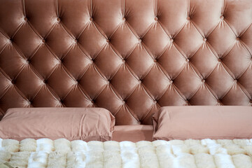 Elegant Velvet Headboard and Cozy Bedding Design