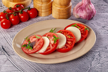 Italian caprese salad with mozzarella, tomato and basil