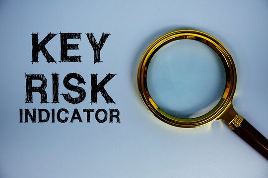 Key Risk Indicator text with magnifying glass on blue background