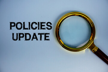 Policies Update text with magnifying glass on blue background