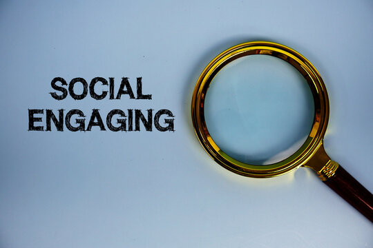 Social Engaging text with magnifying glass on blue background