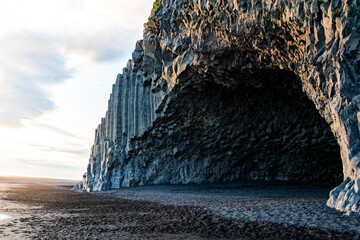 Reynisfjara is Iceland’s famous black sand beach with basalt columns, crashing Atlantic waves, and dramatic sea stacks.