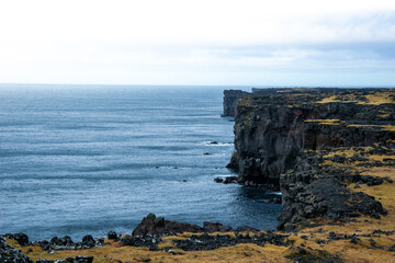 Skardsvik Beach is a rare golden sand beach in Iceland, contrasting dramatically with surrounding...