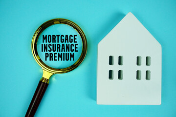 MIP Mortgage Insurance Premium text with house model and magnifying glass on blue background