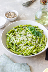 Pasta casarecce with pesto sauce, basil and cheese. Italian cuisine. Vegetarian food.