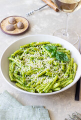 Pasta casarecce with pesto sauce, basil and cheese. Italian cuisine. Vegetarian food.