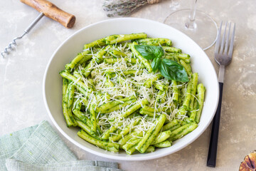 Pasta casarecce with pesto sauce, basil and cheese. Italian cuisine. Vegetarian food.