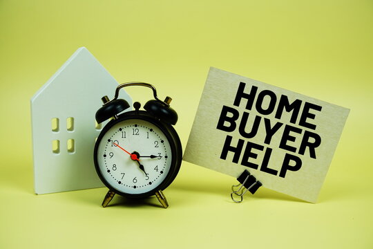 Home Buyer Help text with house model and alarm clock on yellow background