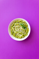 Pasta casarecce with pesto sauce, basil and cheese. Italian cuisine. Vegetarian food.