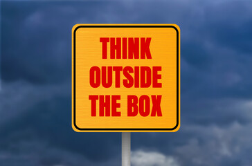Think outside the box message written on metal sign on cloudy sky background. Conceptual think...