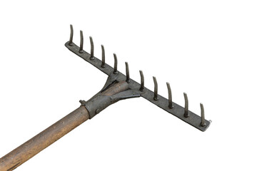 Old rusty metal rake with wooden handle is isolated.