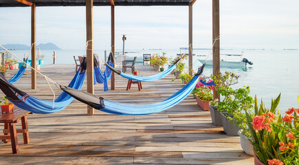 Hammocks on a wooden platform over water, holiday relaxation concept, Semporna district, Borneo,...