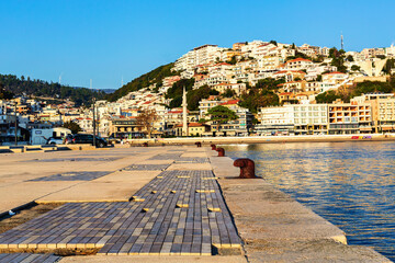Ulcinj city and seafront pier at golden hour with warm sunlight, Montenegro