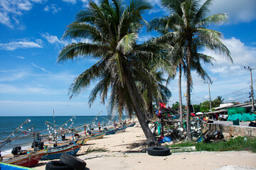 Obraz premium View landscape clouds sky wave in sea ocean and local thai fishers people stop boat ship waiting catch fish marine life on Tabsakae Beach at Thap Sakae on June 2, 2025 in Prachuap Khiri Khan, Thailand