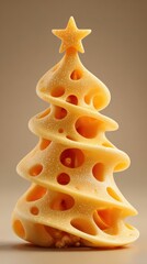 Cheese shaped like a Christmas tree with decorative holes and a star on top displayed on a plain background