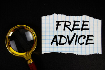 Free Advice text written on paper with magnifying glass